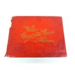 A mid 20th century Will's Cigarette Card Album, red paper bound, containing approximately 150 Will's