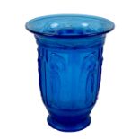 A blue pressed glass flower vase, mid 20th century, decorated with six panels each of a classical