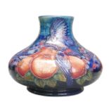 A Moorcroft finches pattern squat vase, with impressed maker's marks to its base, 26 by 19cm high.
