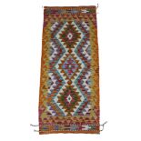 A Chobi Kilim vegetable dye runner with diamond pattern, 143 by 63 cm