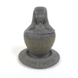 An early 20th century metal Egyptian Revival type canopic jar and cover on stand, with an Imsety