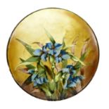 A Doulton Impasto ware dish by Fannie Allen, decorated with blue iris and leaves on a buff ground,