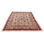 A Persian rug with brown and beige ground, floral decoration, 263 by 227cm.