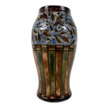 A Royal Doulton stoneware slip cast vase, circa 1915, decorated with a blue frieze of incised and