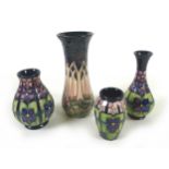 A group of four pieces of Moorcroft, comprising a 'Cluny' patterned vase, of waisted cylindrical