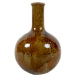 A Royal Doulton 'Natural Foliage-Ware' stoneware bottle vase, circa 1900, decorated with incised