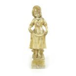 An alabaster sculpture of a young European girl, wearing a bonnet and slightly lifting her skirts,