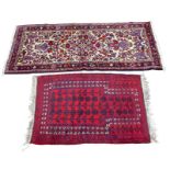 Two Persian rugs, one a prayer rug with red ground, dark blue and purple floral field, 130 by