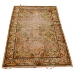 A Persian rug with orange and green patterned field, 155 by 111cm.