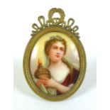 A 19th century oval porcelain miniature portrait, depicting the 18th century French actress Adrienne
