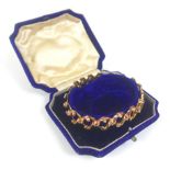 A 9ct gold articulated bracelet, 11.0g, in fitted box.