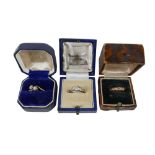 A collection of 18ct gold and diamond rings, comprising a three stone brilliant cut diamond, gold
