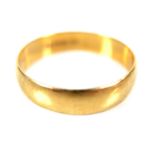 An 18ct yellow gold wedding band ring, of plain form, EJ, London 1983, 5.4mm wide, size X, 4.2g.