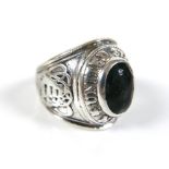 A silver United States Navy dress ring, set with a blue stone to the centre, a/f worn, size R, 18.