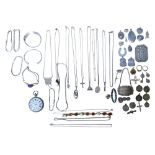 A collection of silver jewellery, including brooches, lockets, necklaces, bracelets, pendants and