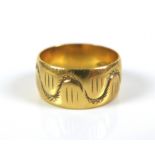 An 18ct gold patterned band, with repeat wave, cross hatch design, size L, 6.28g