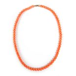 A coral bead necklace with 9ct gold clasp, 25.6g overall, single bead approximately 6mm diameter,