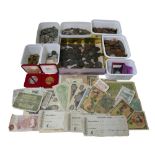 A collection of mixed world coins and banknotes, including an 1851 USA Liberty Dime, an 1858