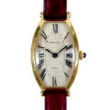 A vintage Cartier 18ct yellow gold cased lady’s Tonneau wristwatch, circa 1986, model No 07 III,