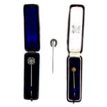 A group of three Victorian stick pins, comprising a 15ct gold pin with diamond chip, 5.5cm, 1.2g,