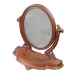 A Victorian mahogany oval swing frame toilet mirror, 62 by 24 by 66.5cm high.