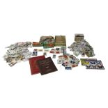 A collection of 20th century stamps and cigarette and tea cards, themes include space, cars, planes,