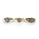 An 18ct gold diamond daisy ring, missing two stones, each stone approximately 1.5mm diameter, size