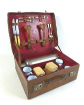 An early 1900s tan leather picnic/motoring travel case by J. S. Vickery London, with a fitted