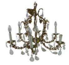 A six branch brass chandelier, late 20th century, with cut glass drops and candle effect lights,