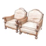 A pair of early 20th century bergere armchairs, with walnut frames, a/f. (2) Damage to sides.