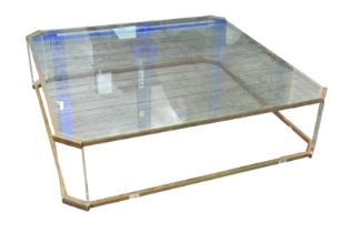 A large brass, lucite / acrylic, and glass topped coffee table, of square form with canted