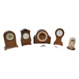 Four wooden cased mantel clocks, including a balloon clock with brass inlays, 24.5cm high,