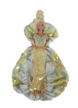A Mattel 1991 Bob Mackie Platinum Barbie doll in original box, with stand.