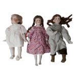 Three hand made and hand painted reproduction bisque dolls, all with impressed marks of back of