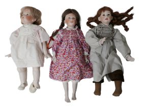 Three hand made and hand painted reproduction bisque dolls, all with impressed marks of back of