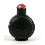 A 19th century Chinese snuff bottle, metal and black enamel, ovoid form with two inscribed panels
