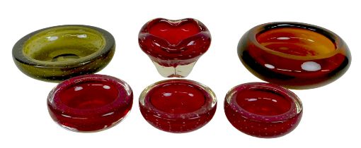 A group of six Whitefriars and Whitefriars style coloured glass bowls, in various designs, four