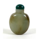 A 19th century Chinese snuff bottle, green and brown jade, ovoid form with darker green stone