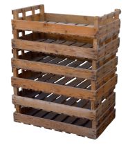 A group of six apple / vegetable crates, with company branding to sides, each 71 by 51 by 20cm high.