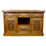 A mid 20th century oak sideboard, in Victorian style, with three drawers and two cupboards with