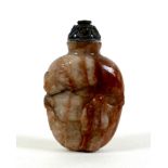 A 19th century Chinese snuff bottle, red and cream variegated hardstone, ovoid form carved with a