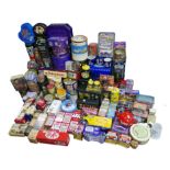 A large quantity of assorted branded tins and mugs. (qty)