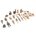 A collection of continental wooden bottle stoppers and treen, including grotesque figures. (1 bag)