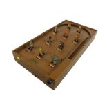 A vintage Chad Valley Tiger Tim's Weekly bagatelle wooden pinball game with seven spare ball