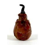 A 19th century Chinese snuff bottle, red and brown hardstone, gourd form carved with raised leaves