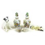 A group of ceramics items, including a pair of Germany floral, lidded vases, with garlands of