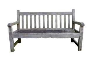 A garden bench, well weathered, with slatted back, 152 by 60 by 89.5cm.