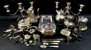 A group of silver plated wears, including a pair of candelabras, tea and coffee pots, a group of