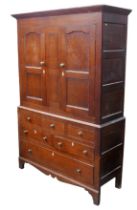 A 19th century oak over pine cupboard, upper section with two panelled doors opening to reveal a