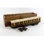 A Bowman O-gauge tinplate carriage, circa 1910, model 550, brown and yellow lithographed body,